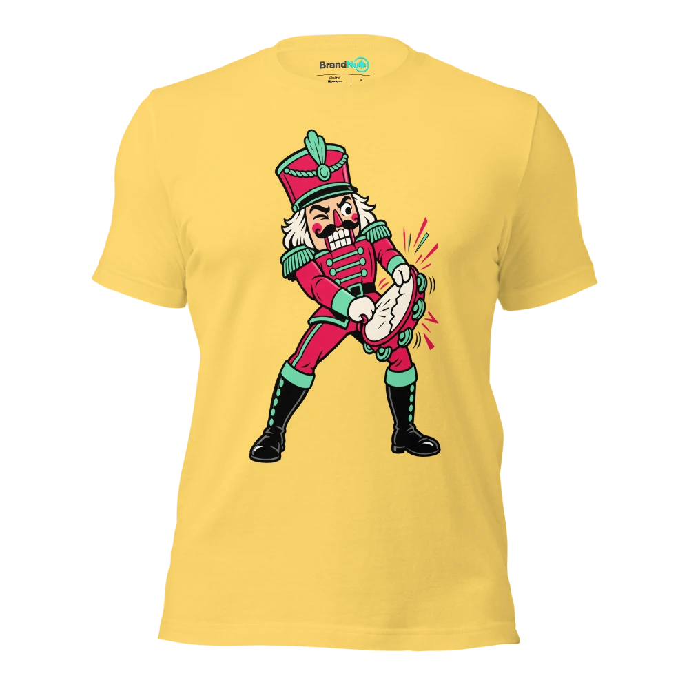 A nutcracker soldier attempting to crack a tambourine T Shirt Yellow Front
